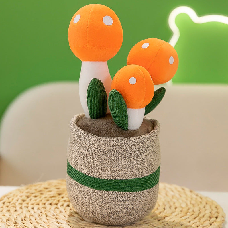 Close up of faux succulent with plush mushroom ornament