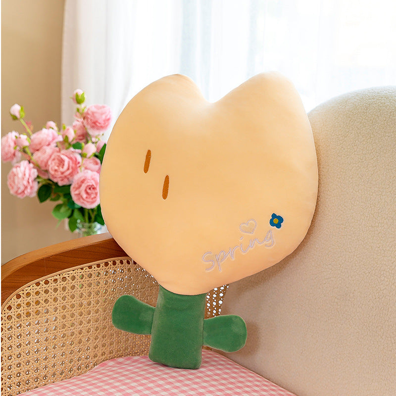 Cute Tulip Plush Pillow being cuddled by a child