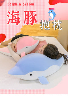 Kids hugging their dolphin plush toy
