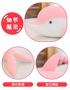 Kids hugging their dolphin plush toy