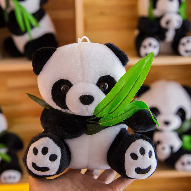 Cuddly panda bear in child's arms