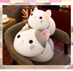 Cuddly cat plush in a child's arms