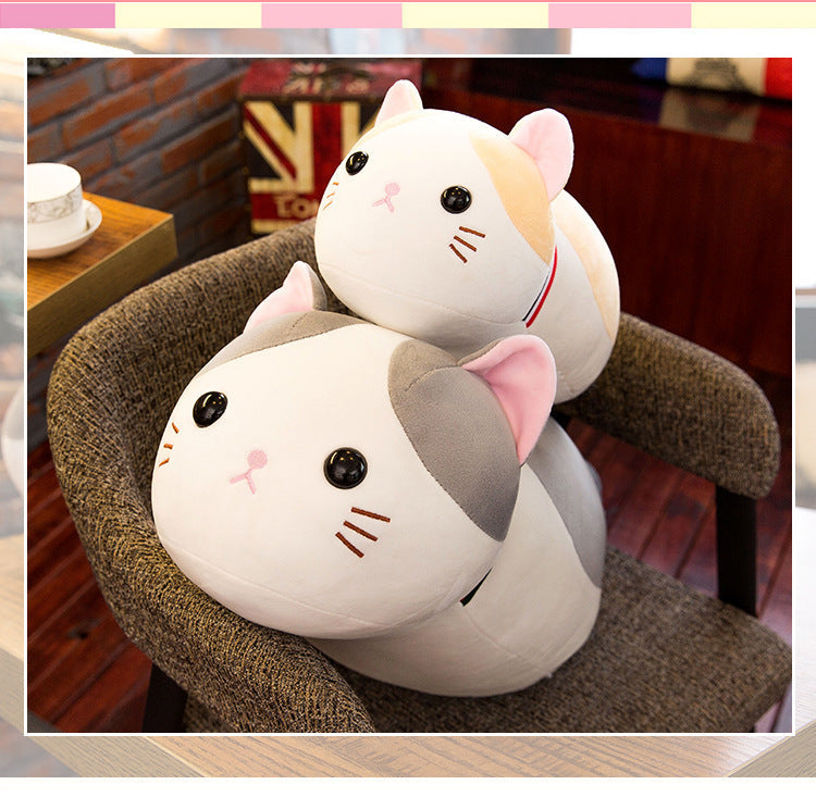 Cuddly cat plush in a child's arms