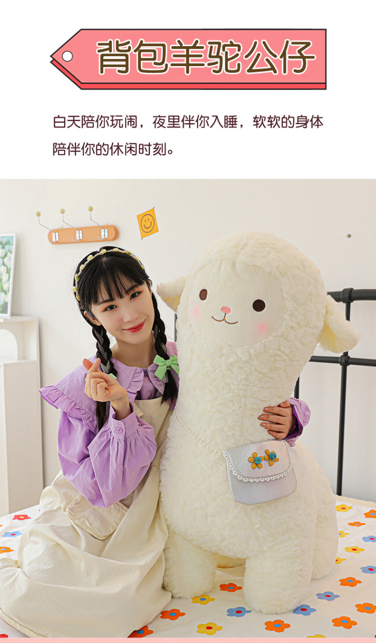alpaca toy cuddled by child