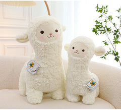 smiling alpaca toy with children