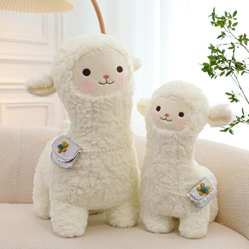 smiling alpaca toy with children