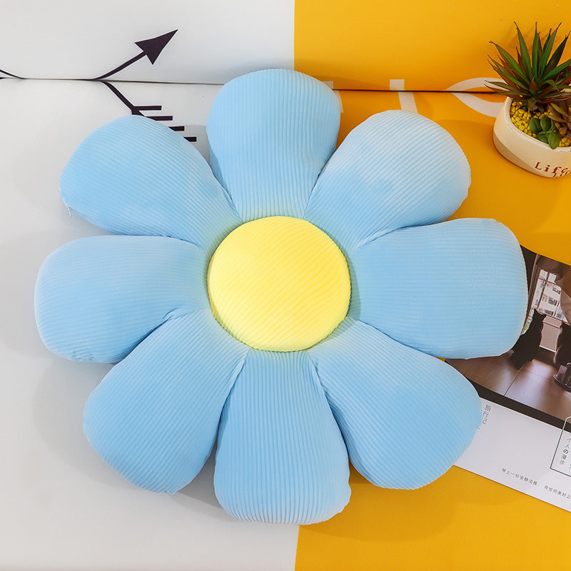 Floral Daisy Cushion Plush Toy on bed