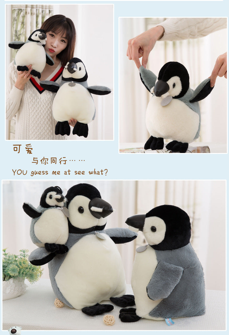 Child playing with Cartoon Penguin Doll