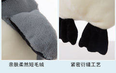Penguin plush with a child at bedtime