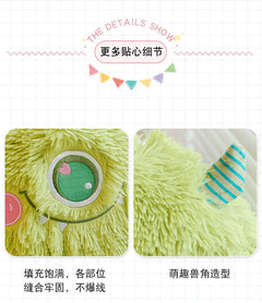 Adorable monster plush pillow on a bed showcasing its design
