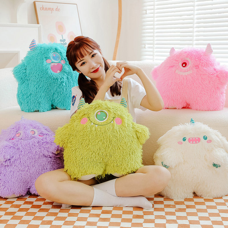 Cute monster plush pillow showing soft texture and charm
