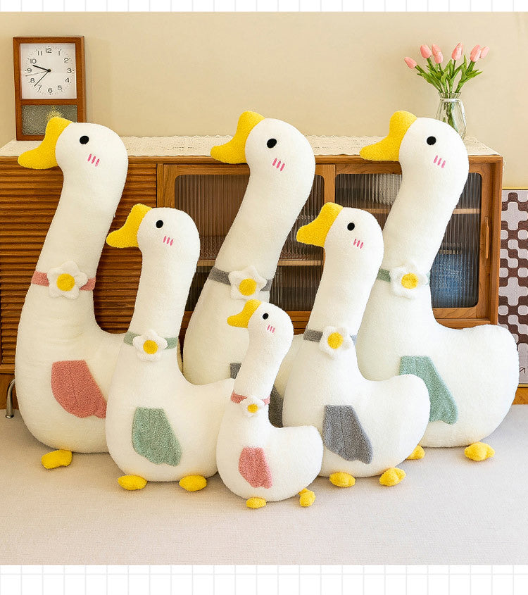 Luxury large plush goose body pillow on bed