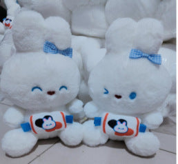Child playing with plush fruit dolls
