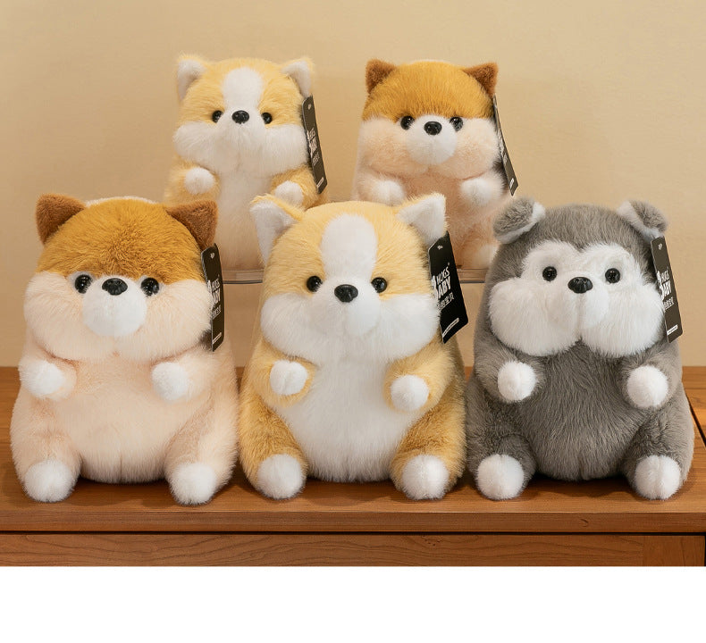 Corgi plush toy displayed on a couch