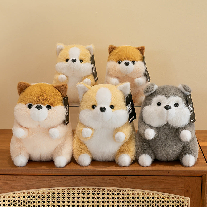Corgi plush toy displayed on a couch