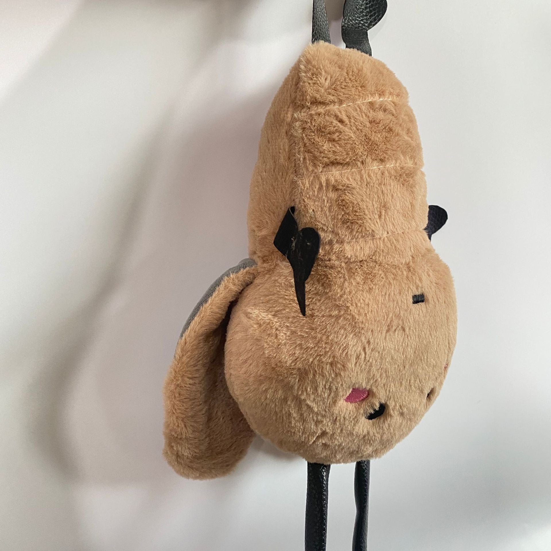 Roach toy with dark brown colour