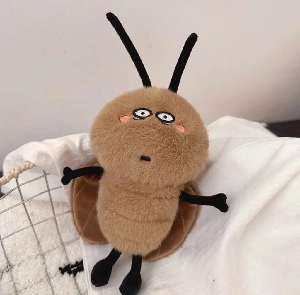 Roach Plush Toy cuddled in hands