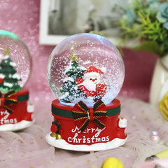 Close-up of musical snow globe showing automatic snowfall