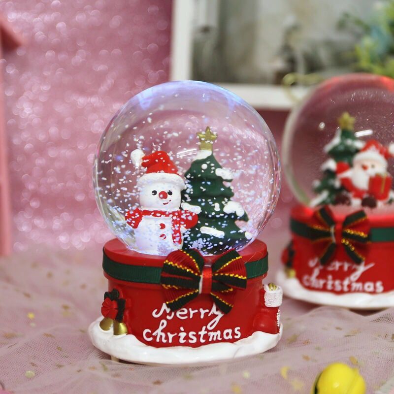 Enchanting Christmas-themed snow globe with vibrant lights