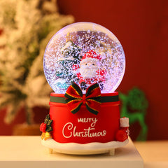Close-up of musical snow globe showing automatic snowfall
