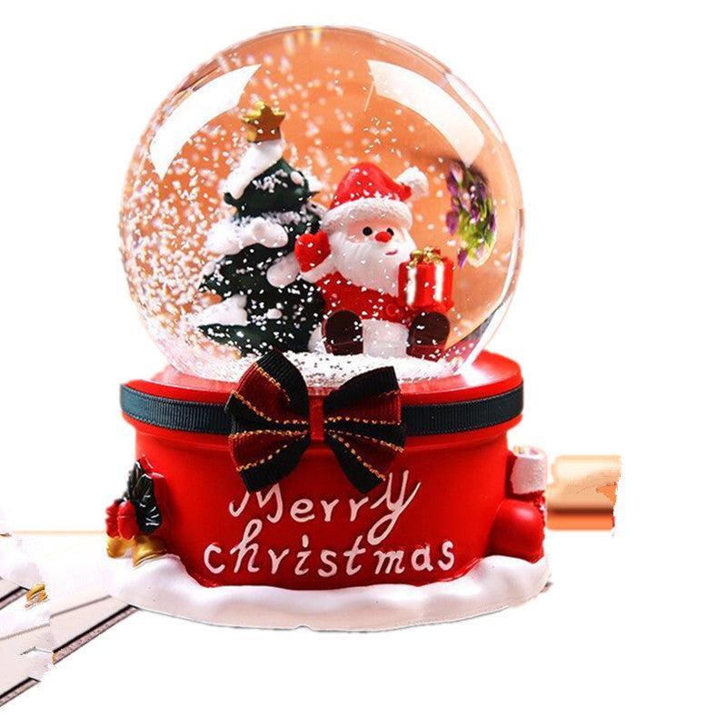 Beautifully lit Christmas snow globe at night