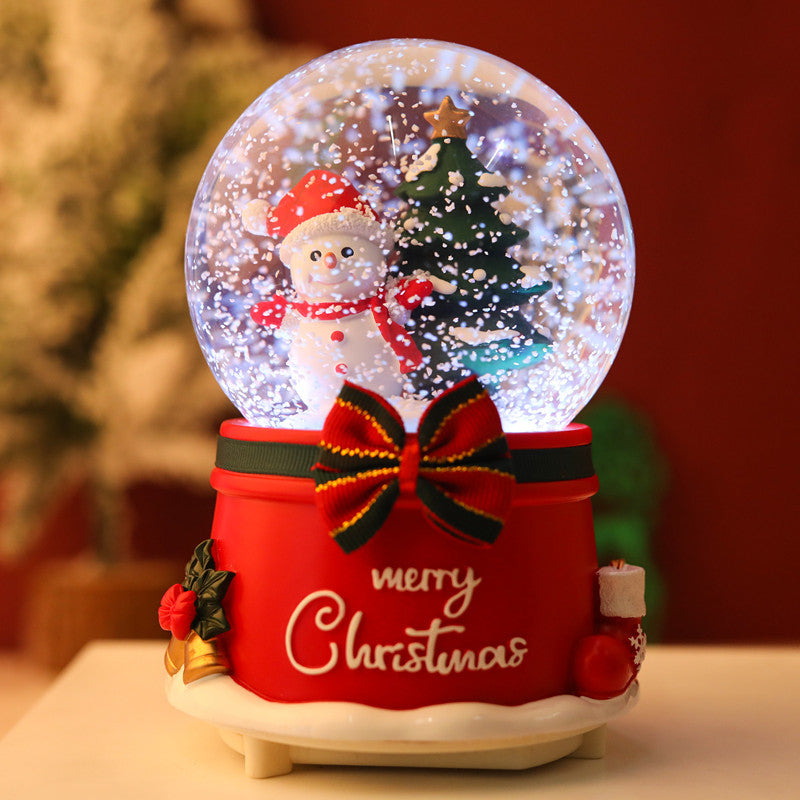Rotating snow globe featuring holiday decorations