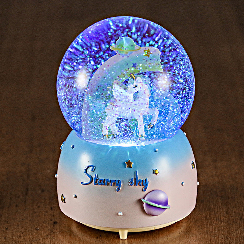 Magical unicorn scene in snow globe