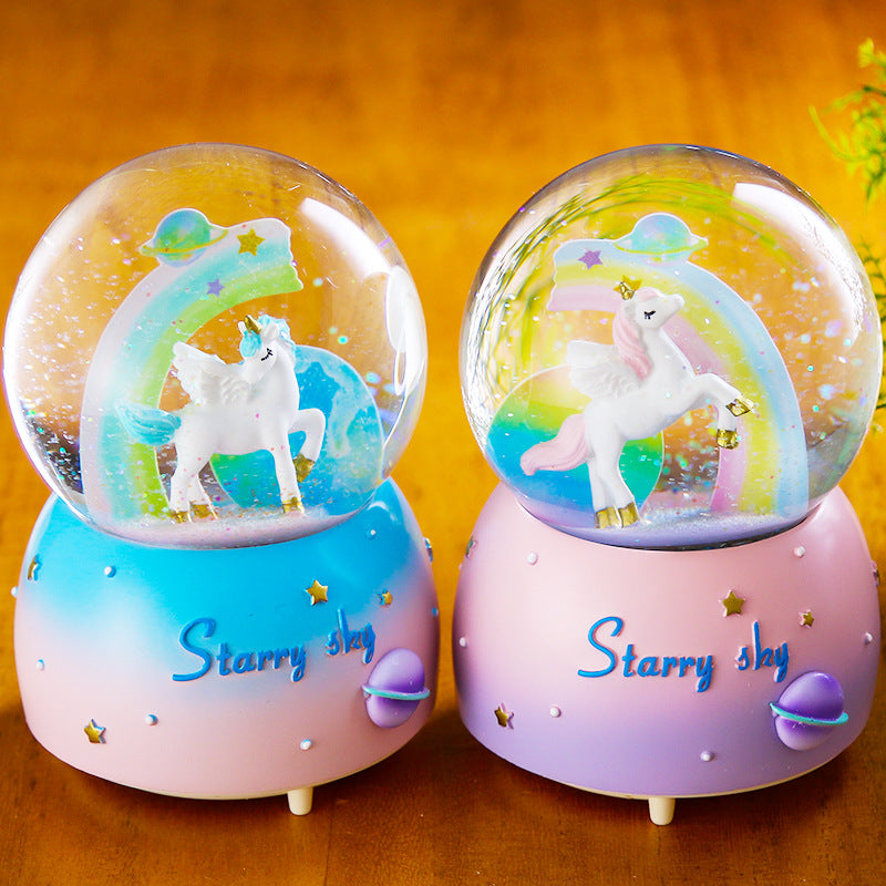 Pink unicorn snow globe with music