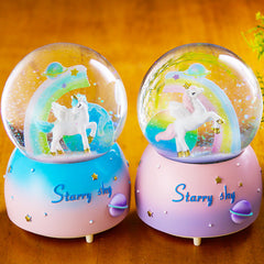 Pink unicorn snow globe with music