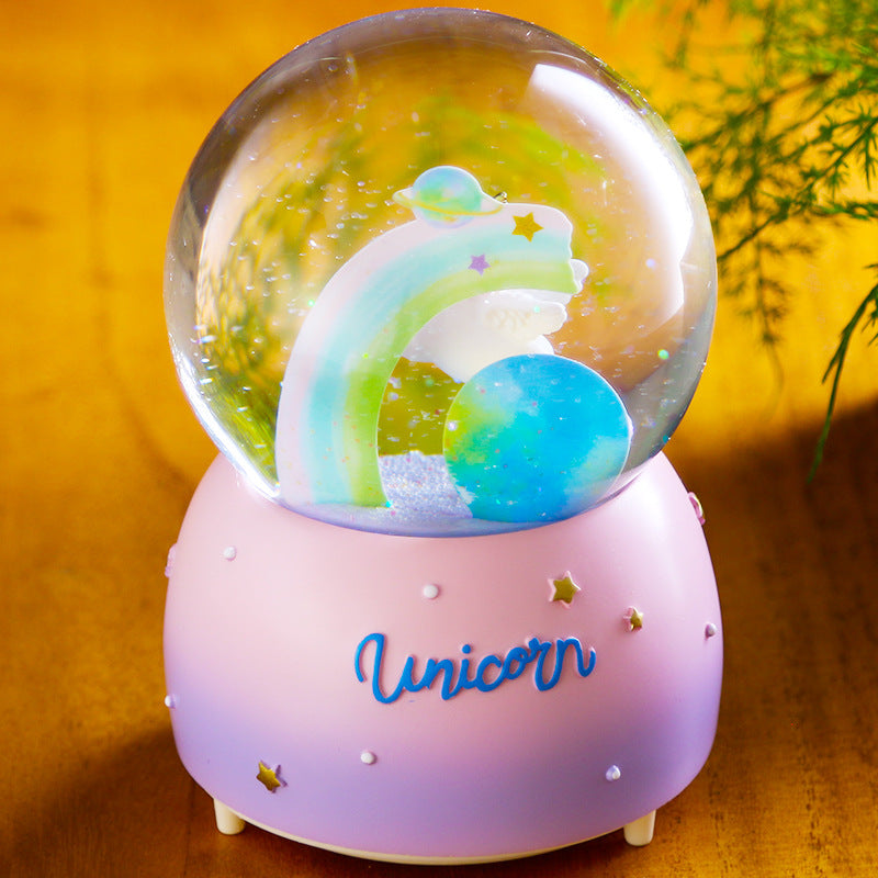 Close-up of unicorn in snow globe