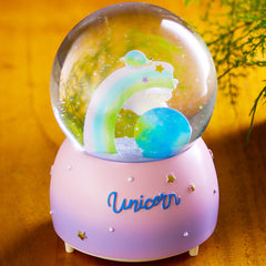 Close-up of unicorn in snow globe