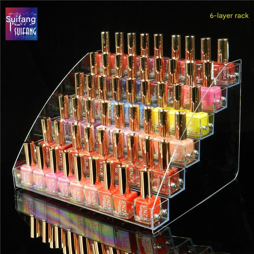 Close-up view of clear acrylic makeup organizer with products