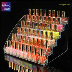 Close-up view of clear acrylic makeup organizer with products