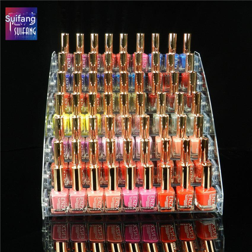 Close-up view of clear acrylic makeup organizer with products