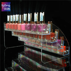 Top view of multi-tier lipstick holder displaying various cosmetics