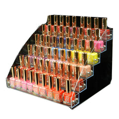 Acrylic nail polish display stand filled with bottles