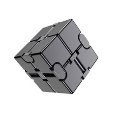User engaging with a vibrant patterned metal stress cube