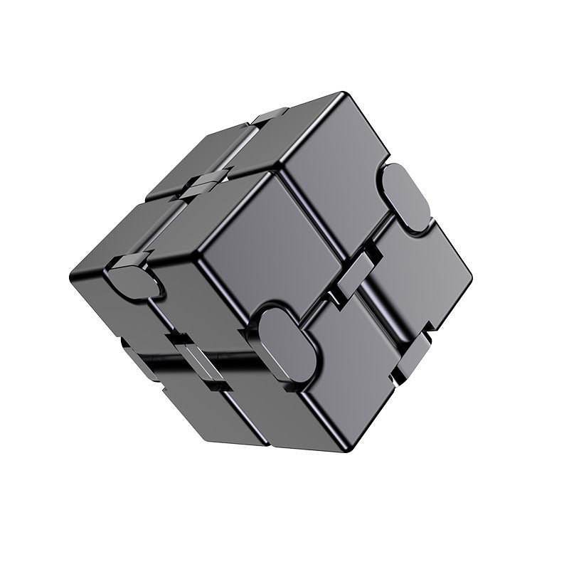 User engaging with a vibrant patterned metal stress cube