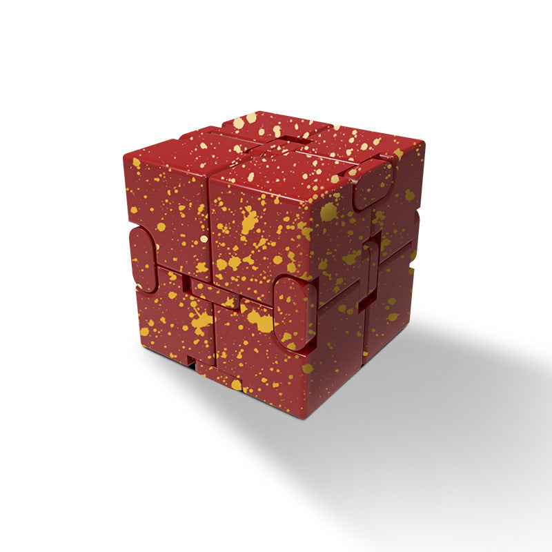 User engaging with a vibrant patterned metal stress cube