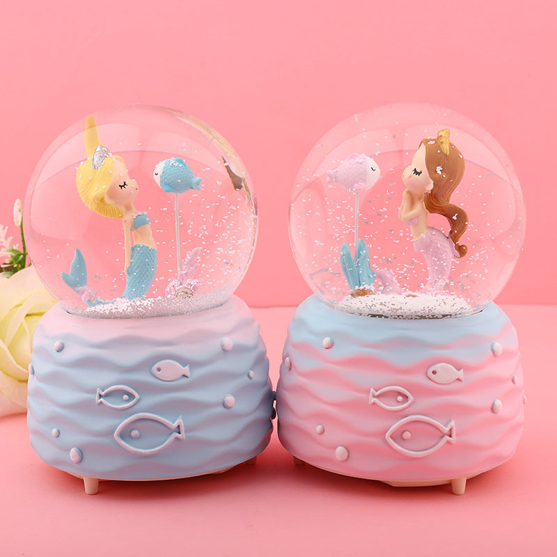 Blue mermaid music box illuminated with colours