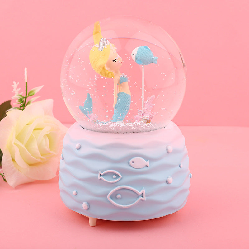 Detailed view of the mermaid inside the snow globe