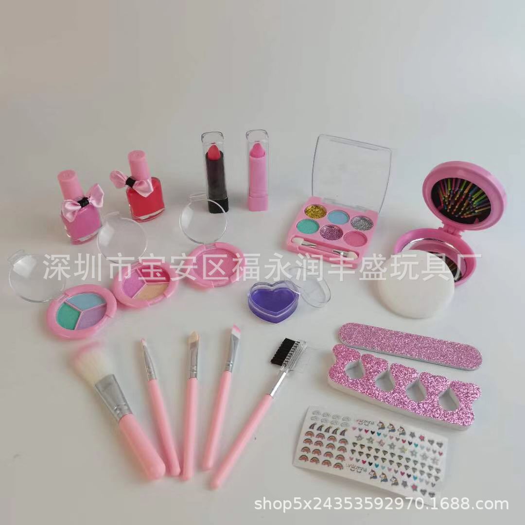 Smiling girl holding medley of lip gloss and eyeshadows