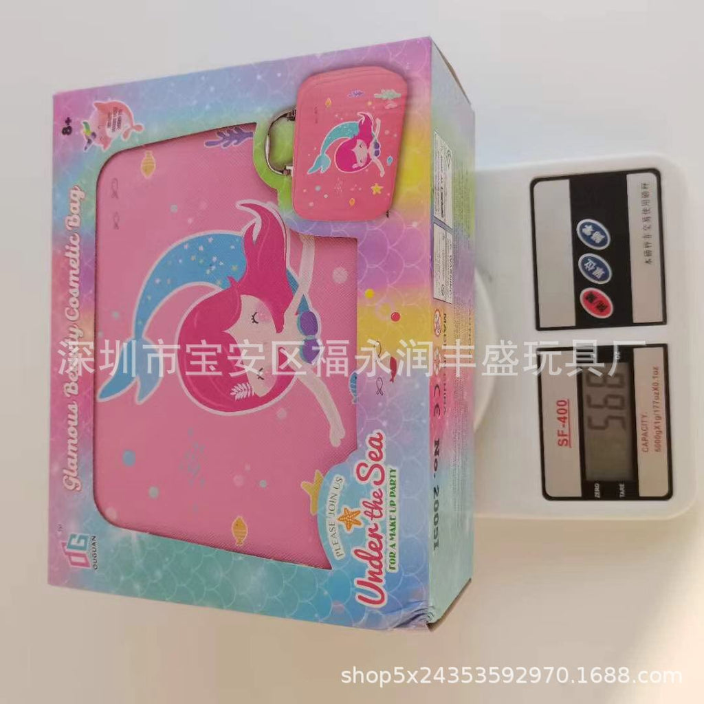 Smiling girl holding medley of lip gloss and eyeshadows