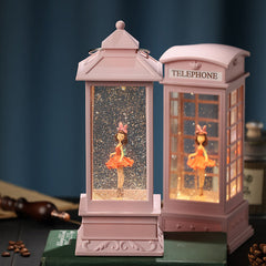 close-up of rotating ballet dancer in snow globe