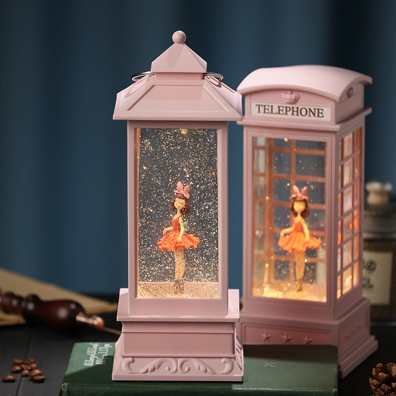 close-up of rotating ballet dancer in snow globe