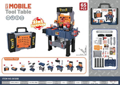 Child playing with colourful tool set and accessories
