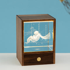 Astronaut and reindeer LED night light on table