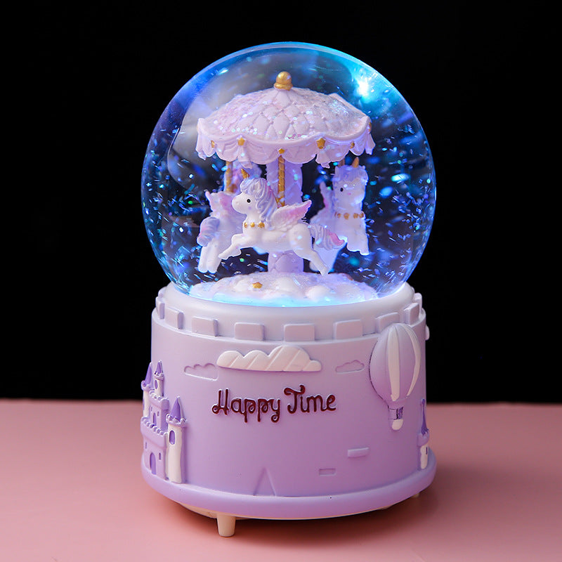 Side view of carousel music box showing snow drift feature