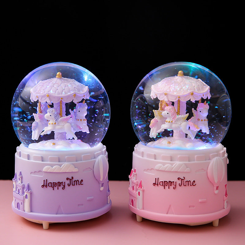 Close-up of the hand-painted details on the carousel music box