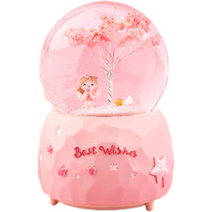 Close-up of crystal ball in angel music box